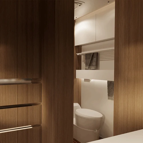 Bathroom with warm wood panels and storage cabinets