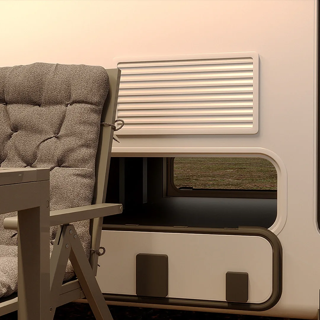 Camping chair and table beside the open front garage